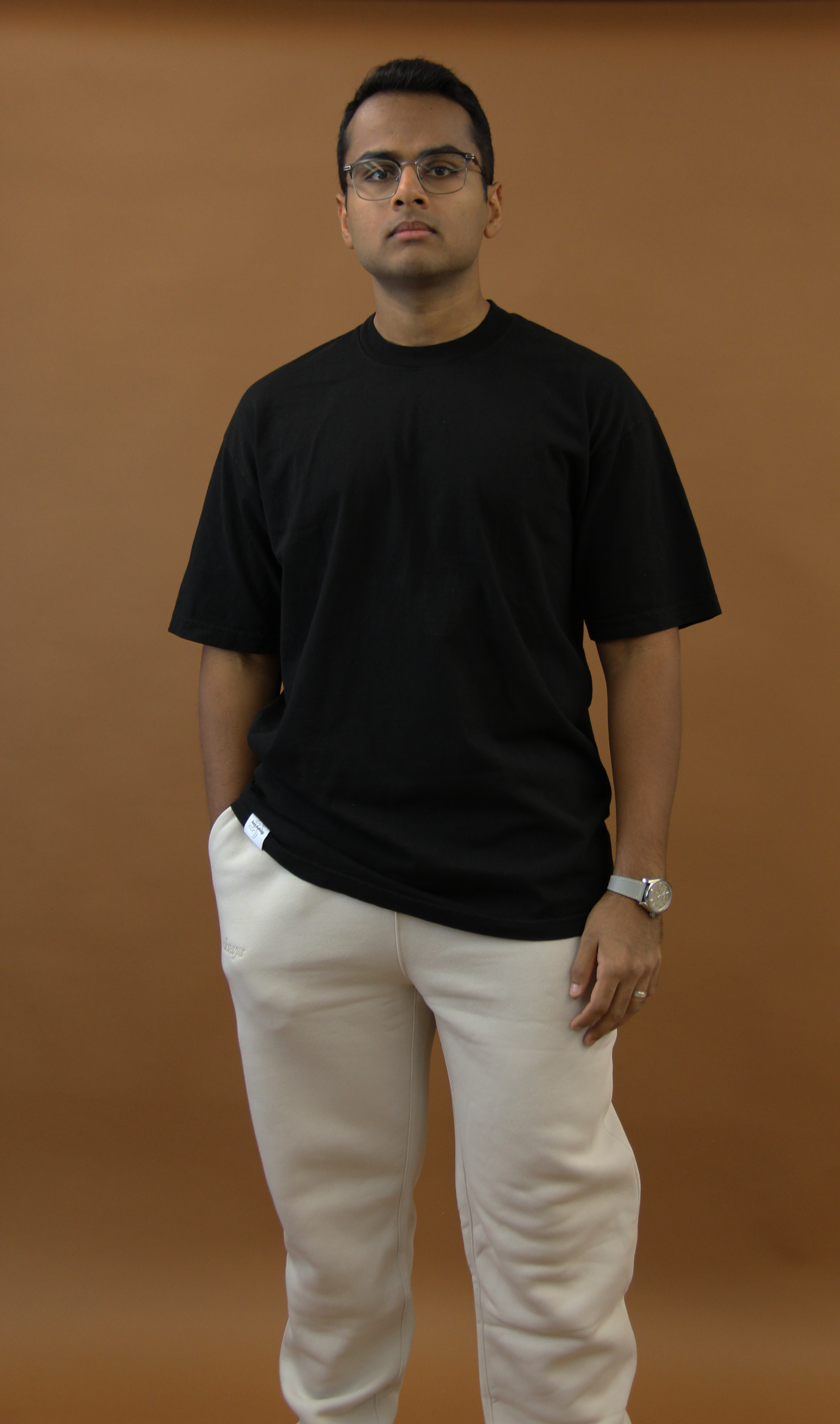 LA-made cotton tee, ribbed collar, hand-stitched tag. Versatile city style at $25. Black, front, model